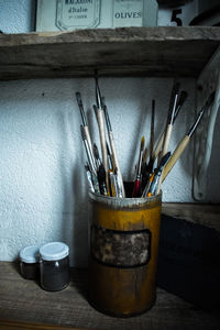 Close-up of paintbrushes on table