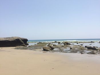 Scenic view of beach against clear sky