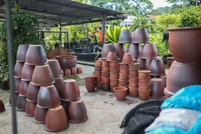 Stack of firewood for sale at market stall