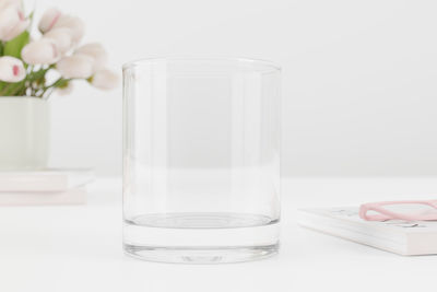 Close-up of drink in glass on white table