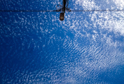 Directly below shot of street light against sky