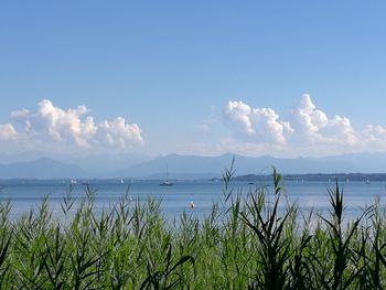 Scenic view of mountains against cloudy sky