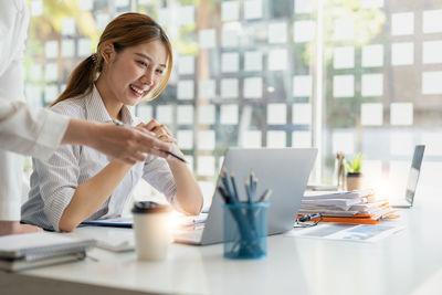 Businesswoman working on table