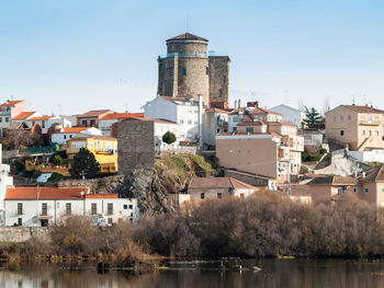 Buildings in city against sky