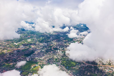 Aerial view of landscape against cloudy sky