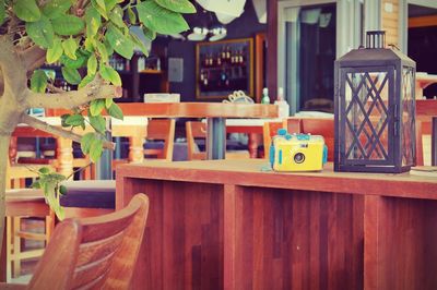Wooden chairs and tables arranged on hardwood floor