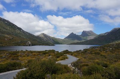 Scenic view of lake and mountains against sky