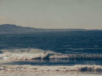 Scenic view of sea against clear sky