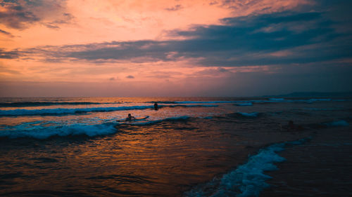 Scenic view of sea against sky at sunset