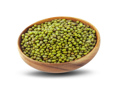 Close-up of fruits in bowl against white background