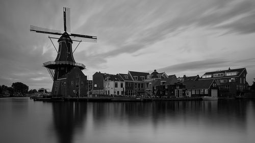 Traditional windmill against cloudy sky