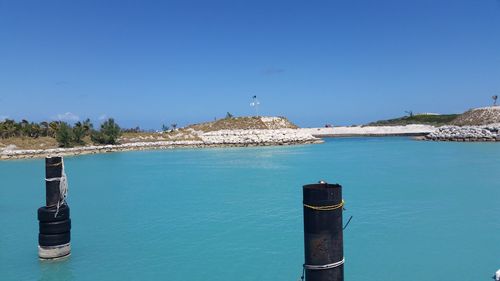 Scenic view of sea against clear blue sky