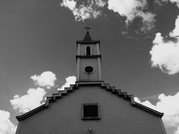 Low angle view of bell tower against sky