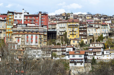 Houses against sky in city