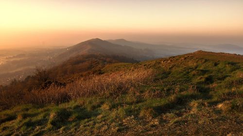 Scenic view of landscape against sky during sunset