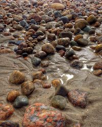 Close-up of pebbles in water