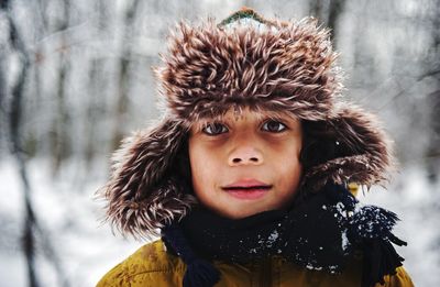 Portrait of boy in fur coat