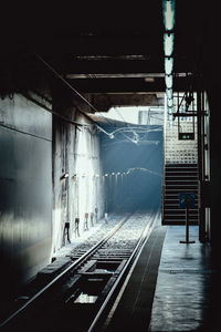 Sunlight falling on railroad track at subway station