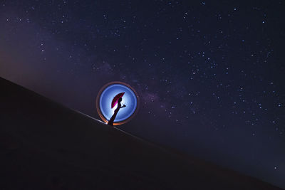 Low angle view of moon against sky at night