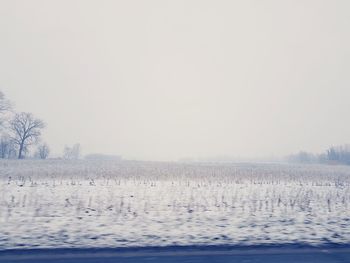 Scenic view of landscape against sky during winter