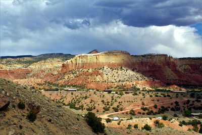 View of castle on mountain against cloudy sky