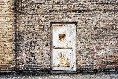 Graffiti on wall of old building