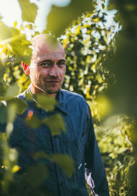 Portrait of smiling man standing outdoors