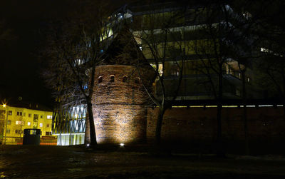 Low angle view of illuminated building at night