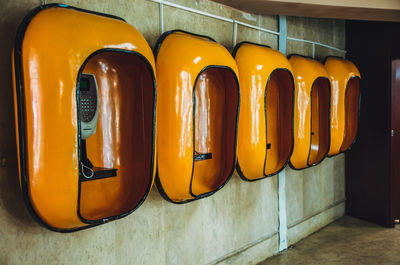 Close-up of yellow lights hanging on wall