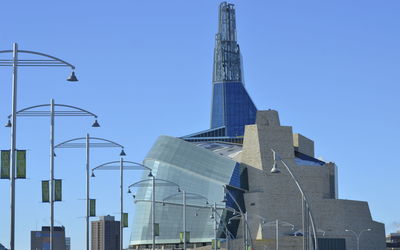 Low angle view of buildings against blue sky