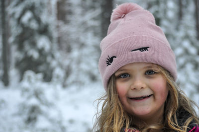 Portrait of smiling girl in snow