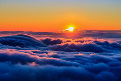 Fascinating sea of clouds and mounta in scenery at sunset clear golden sky,dreamy view,close up