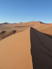 Scenic view of desert against clear sky
