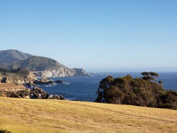 Scenic view of sea against clear blue sky