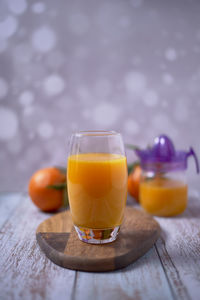Orange juice in glass on table