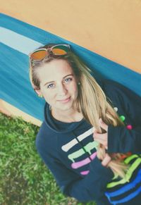 Portrait of smiling young woman standing outdoors