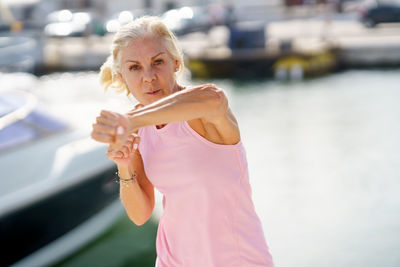 Portrait of mature woman at harbor