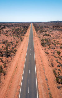 Road amidst landscape against clear sky