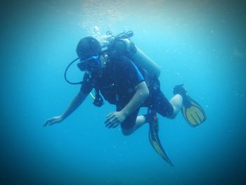 Full length of scuba diver in sea