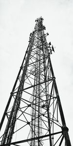 Low angle view of electricity pylon against sky