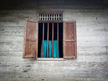 Closed wooden door of old building