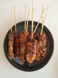 High angle view of meat on barbecue grill