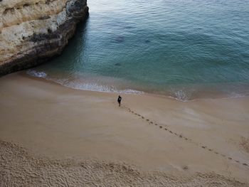 Man walking on beach