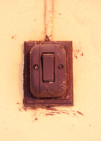 Close-up of old telephone on wall