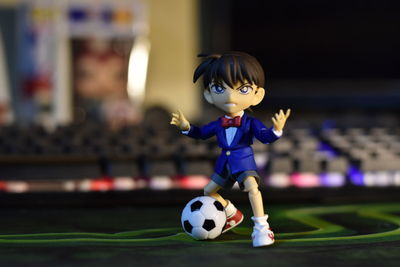 Close-up of boy playing with toy ball