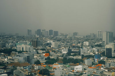 High angle view of buildings in city against sky