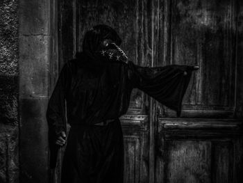 Woman standing in cemetery