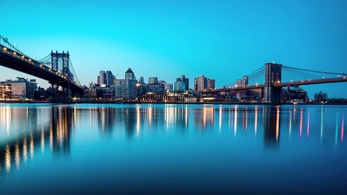 Illuminated city at waterfront