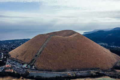 Aerial view of hill against sky
