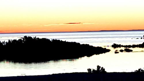 Scenic view of sea at sunset